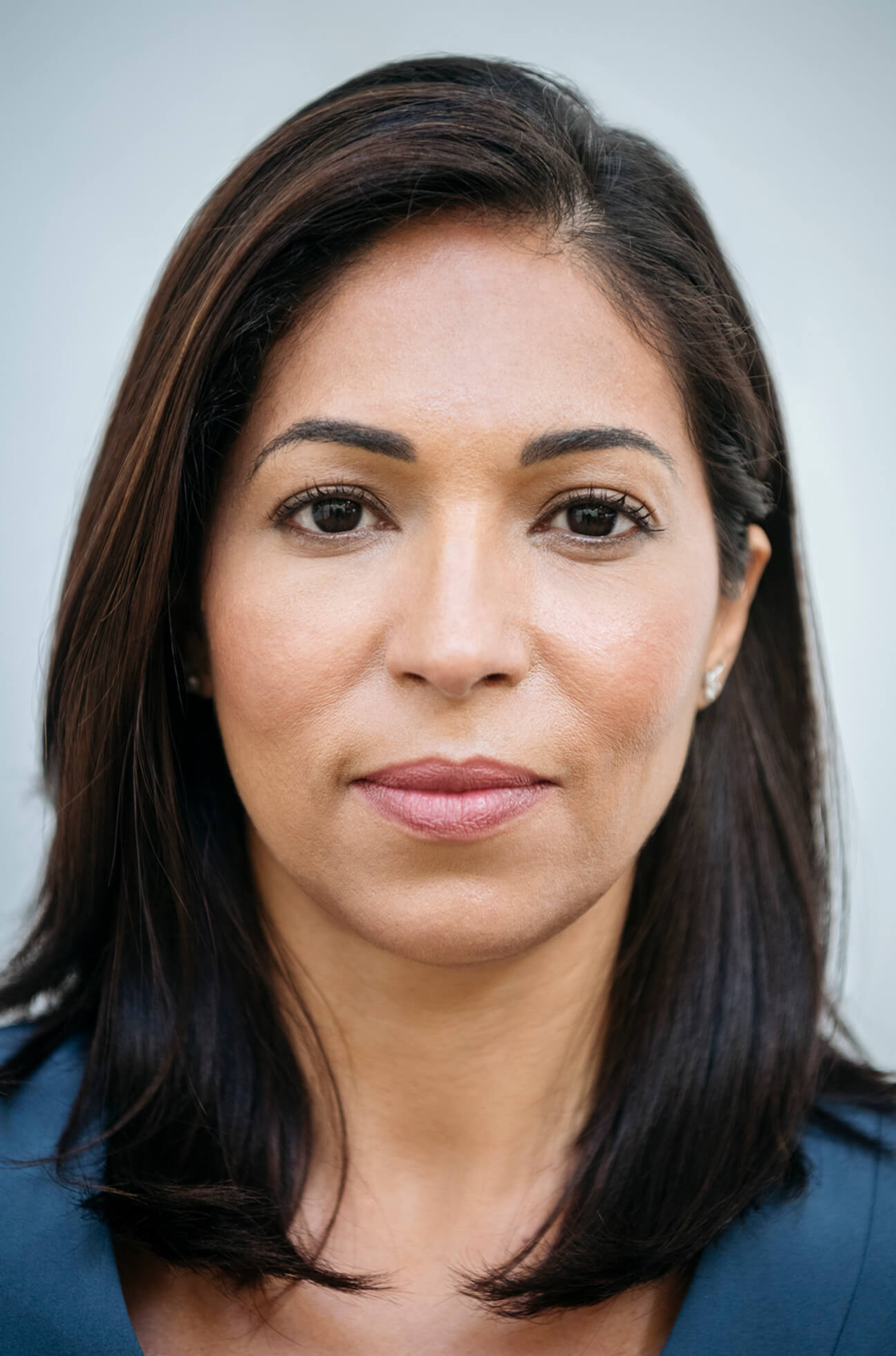 Woman with slim, defined cheeks and naturally contoured facial features